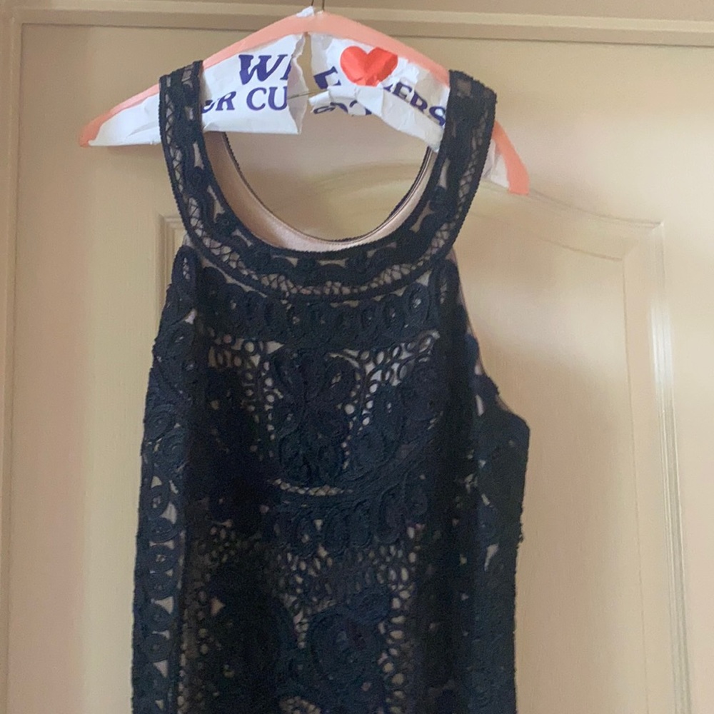 Black lace dress with tan slip underneath
